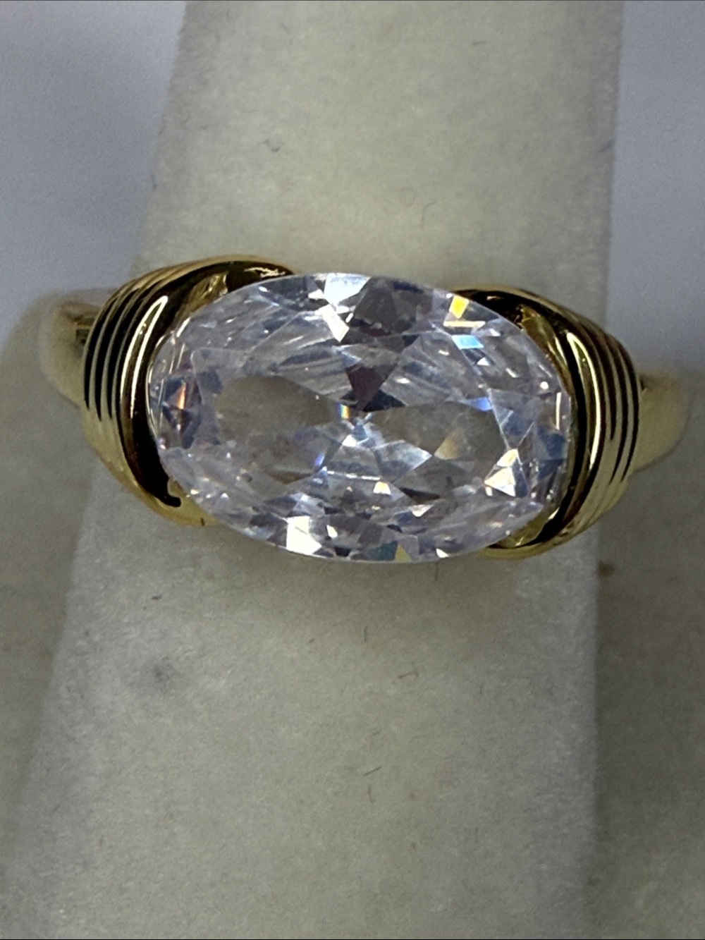 Gold Ring with Large Oval East West Clear Stone